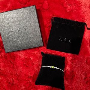 Sterling Silver peridot bolo bracelet with white sapphires.